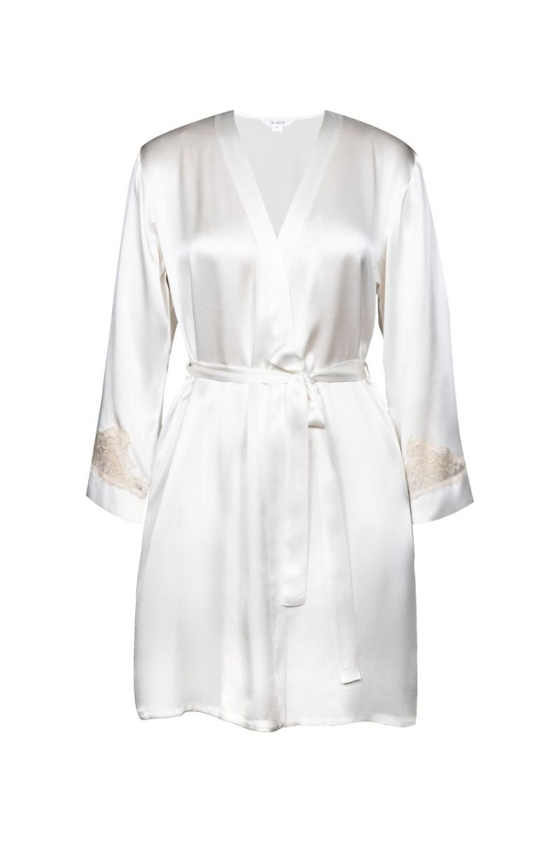 NK IMODE CULT MIA X NK IMODE Morgan short robe in ivory, soft fabric with relaxed fit and short sleeves, displayed hanging on a hook.