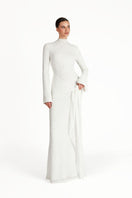 Khanum's white maxi dress with flowing fabric and elegant design, perfect for formal or casual summer occasions.