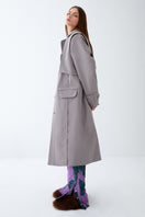 Gray ColoReve trench coat, stylish jacket with classic design, shown on a model, perfect for sophisticated outerwear.
