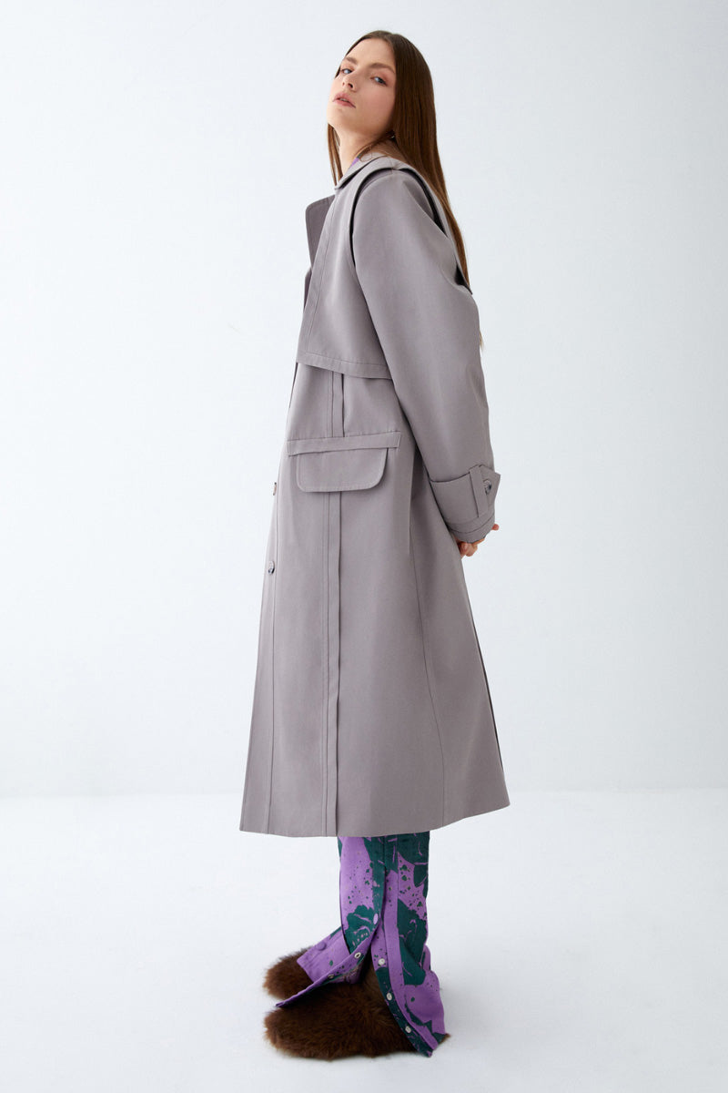 Gray ColoReve trench coat, stylish jacket with classic design, shown on a model, perfect for sophisticated outerwear.