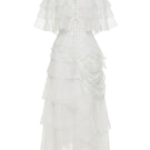 White Plan Thomas maxi dress displayed on a hanger, featuring a flowing fabric and elegant design, perfect for summer or casual wear.