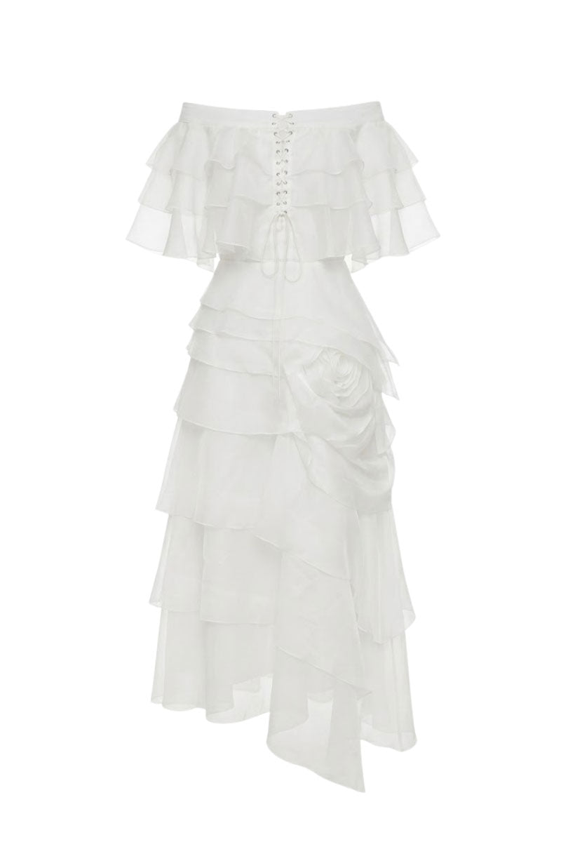 White Plan Thomas maxi dress displayed on a hanger, featuring a flowing design and elegant fabric suitable for summer wear.