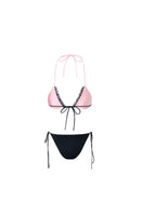 Reversible pink and black bikini set by Suncillo, showing the stylish two-tone design and adjustable straps on a model.