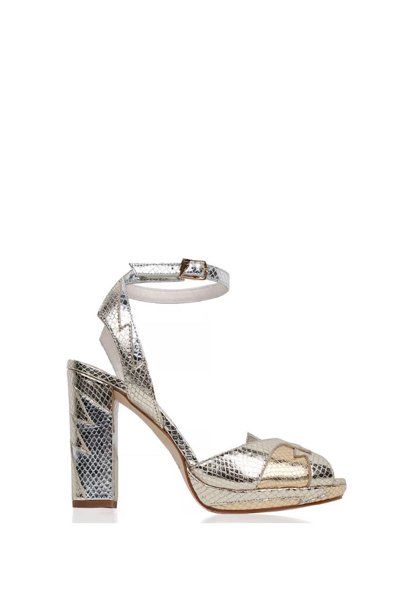 Terry de Havilland ZIA mid heels in shiny gold Platino with sleek design and pointed toe, stylish footwear for women.
