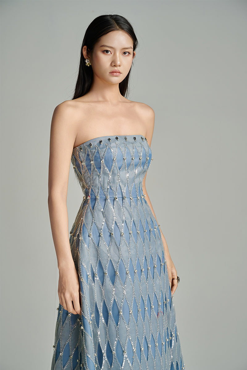 Blue strapless gown by HAPPY CLOTHING featuring a stone fabric and matching scarf, styled for elegant occasions.