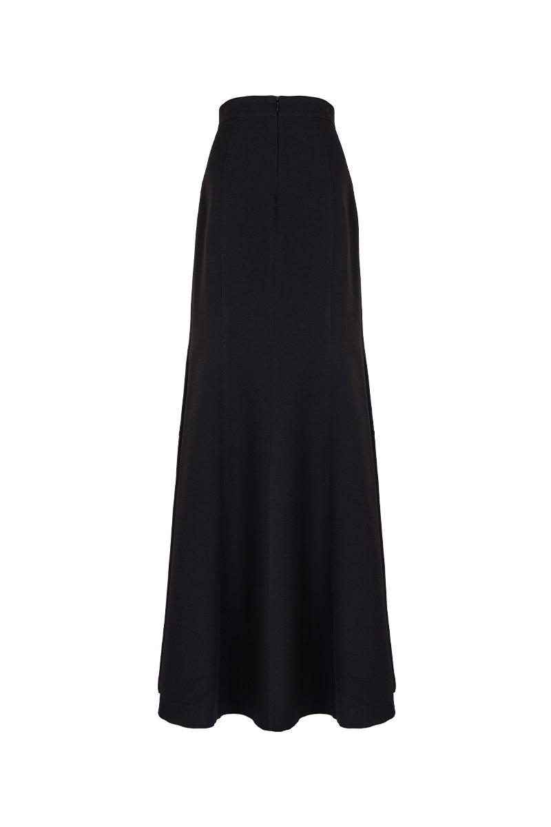 Black paneled construction mermaid maxi skirt by GVLUX featuring layered fabric and a fitted silhouette.