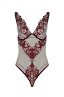 Entos Oolog Body in Burgundy, a stylish fitted bodysuit with long sleeves and scoop neckline, displayed on a hanger.