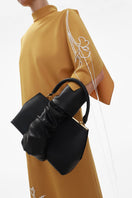 ELENAREVA ochre one-sleeve embroidered wool midi dress displayed on a hanger, showcasing intricate embroidery and elegant design.