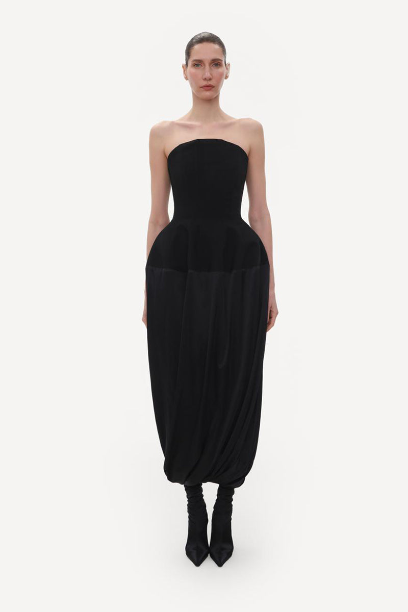 Black wool bustier midi dress with silk skirt by Elenareva, showing a fitted bodice and flowing midi-length hem.