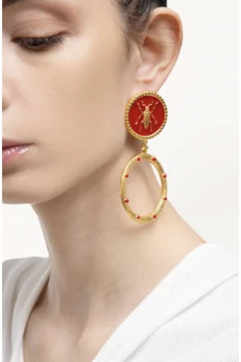 Red bug earrings with hoop, stylish jewelry by Natia x Lako featuring vibrant insect design in metal and enamel.