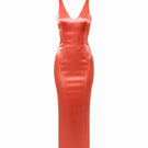 Junie coral maxi dress with a flowing silhouette and adjustable straps, perfect for summer or casual occasions.