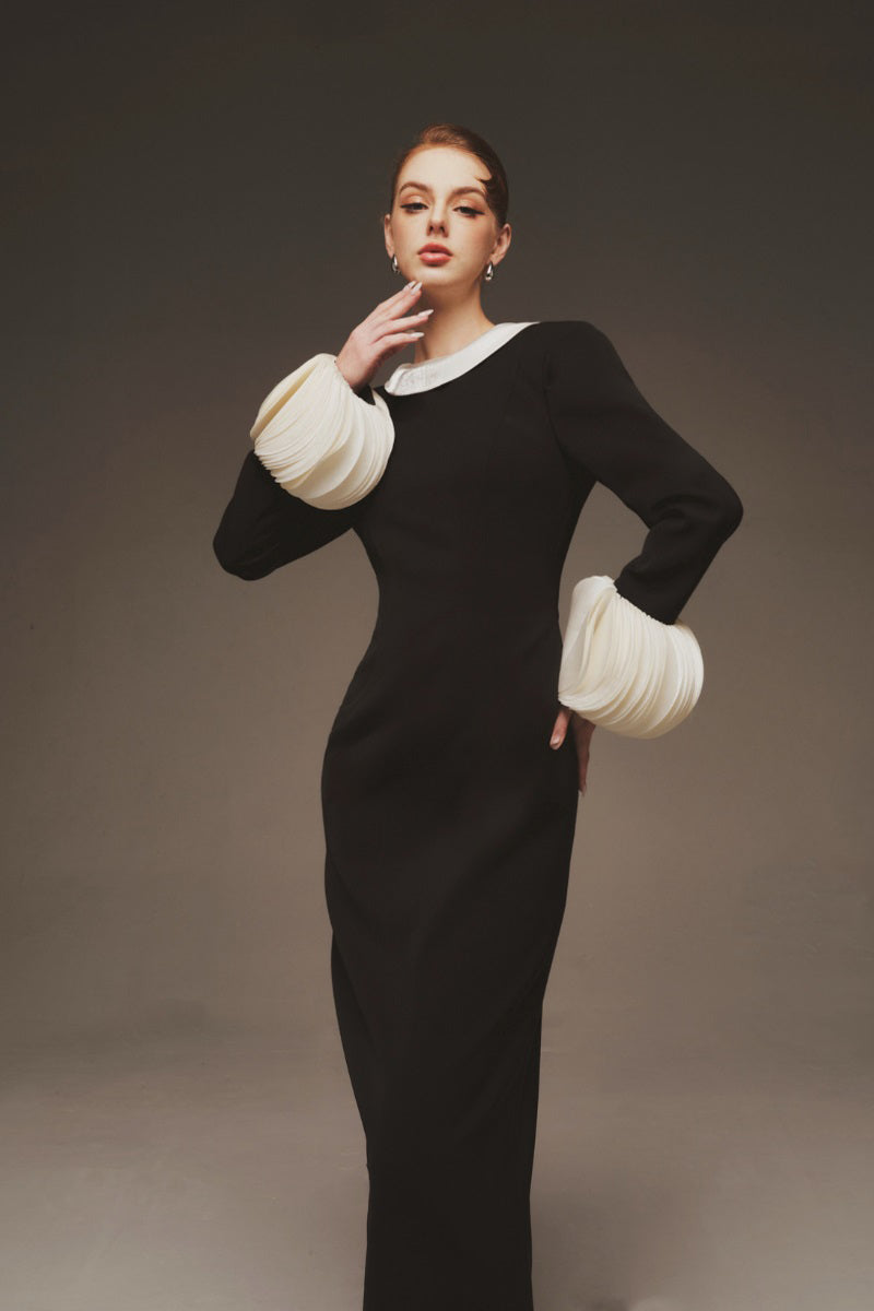Margée Atelier Aurora Cuffs maxi dress displayed on a mannequin, showcasing its flowing fabric and elegant design.