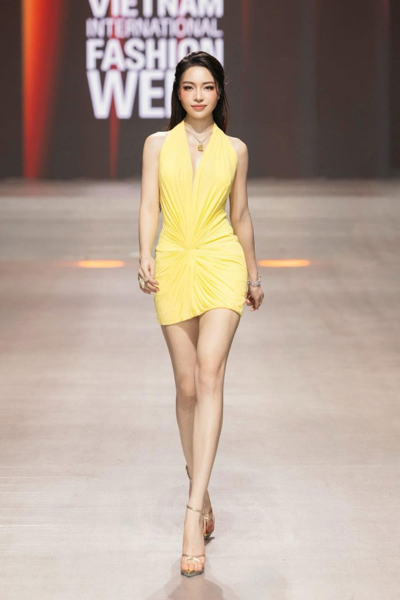 CEM draped knit mini dress featuring a fitted silhouette and soft fabric, perfect for casual or evening wear.