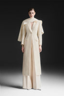 Maison Des Copains ivory cream V-neck trench coat with classic design and tailored fit, displayed on a neutral background.