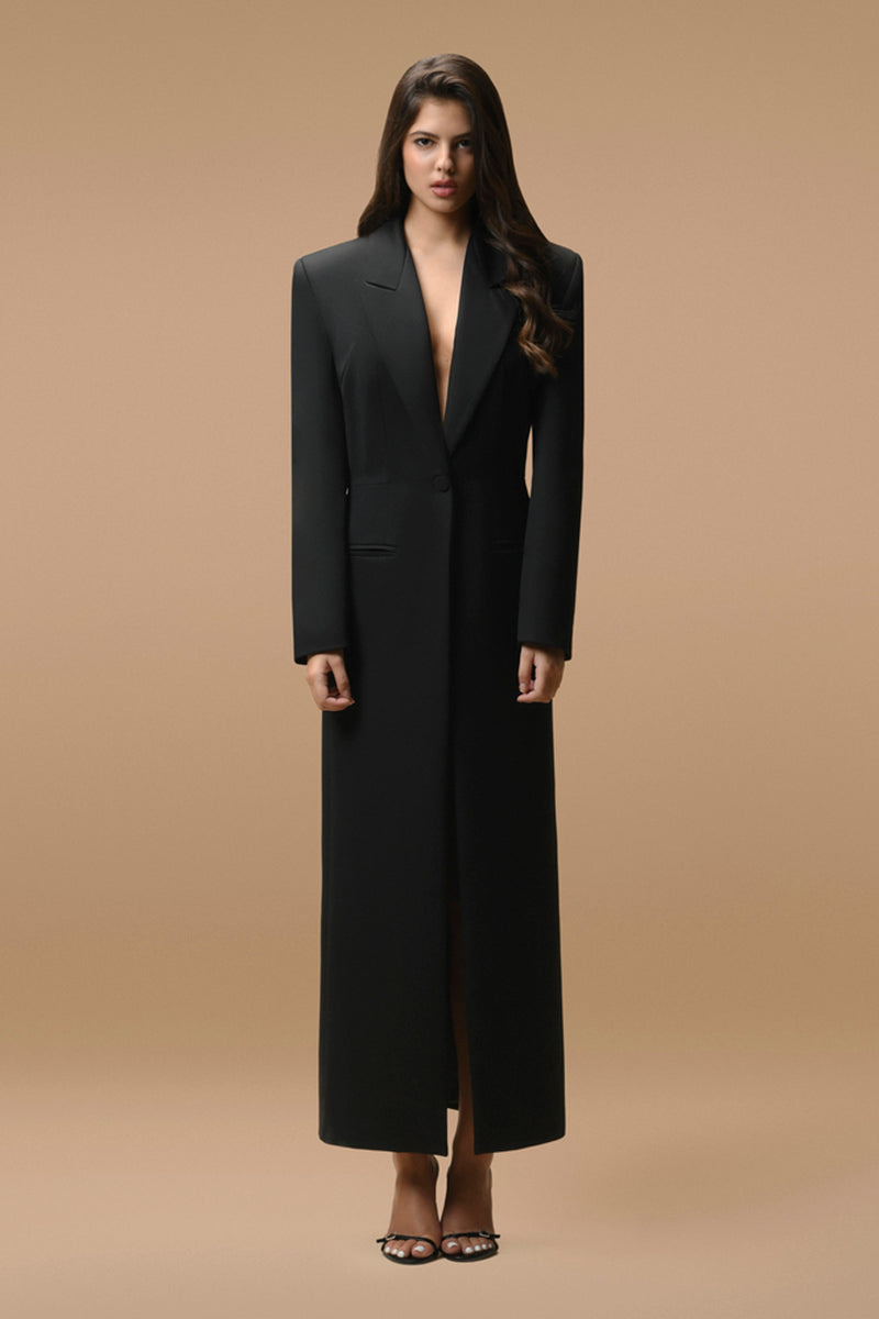 Matters black Celine coat displayed on a hanger, showcasing sleek design and tailored fit in a stylish outerwear piece.