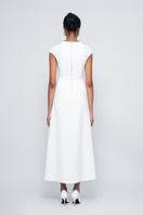 White Squeeze Maxi Dress by TONYY featuring a flowing silhouette and elegant design, perfect for stylish summer or formal occasions.
