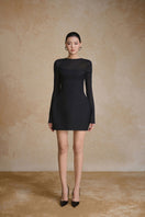 Arti Apparel Prism Dress mini dress with vibrant geometric pattern, stylish fit, and sleeveless design shown on a model.