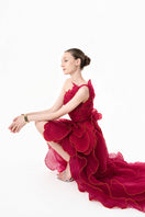 HAPPY CLOTHING CULT MIA X burgundy sculpted petal one-shoulder gown with elegant draping and a fitted silhouette.