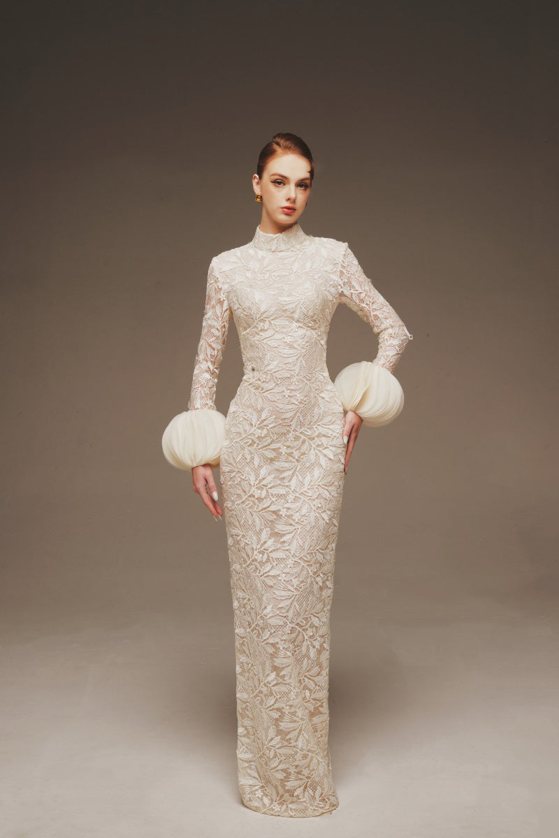 Elegant AURA lace column maxi dress by Margée Atelier with intricate lace details and a flowing silhouette.