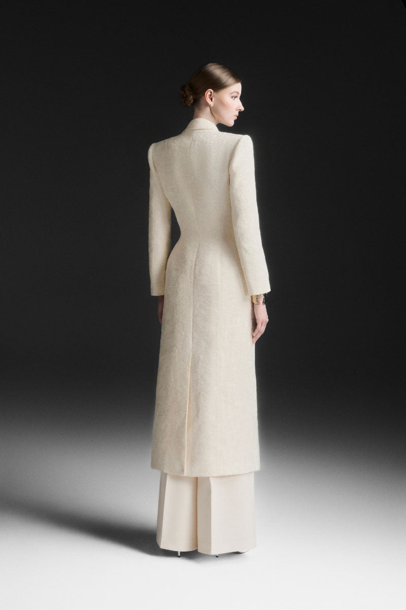 Maison Des Copains ivory cream V-neck trench coat with classic design and tailored fit, displayed on a hanger.
