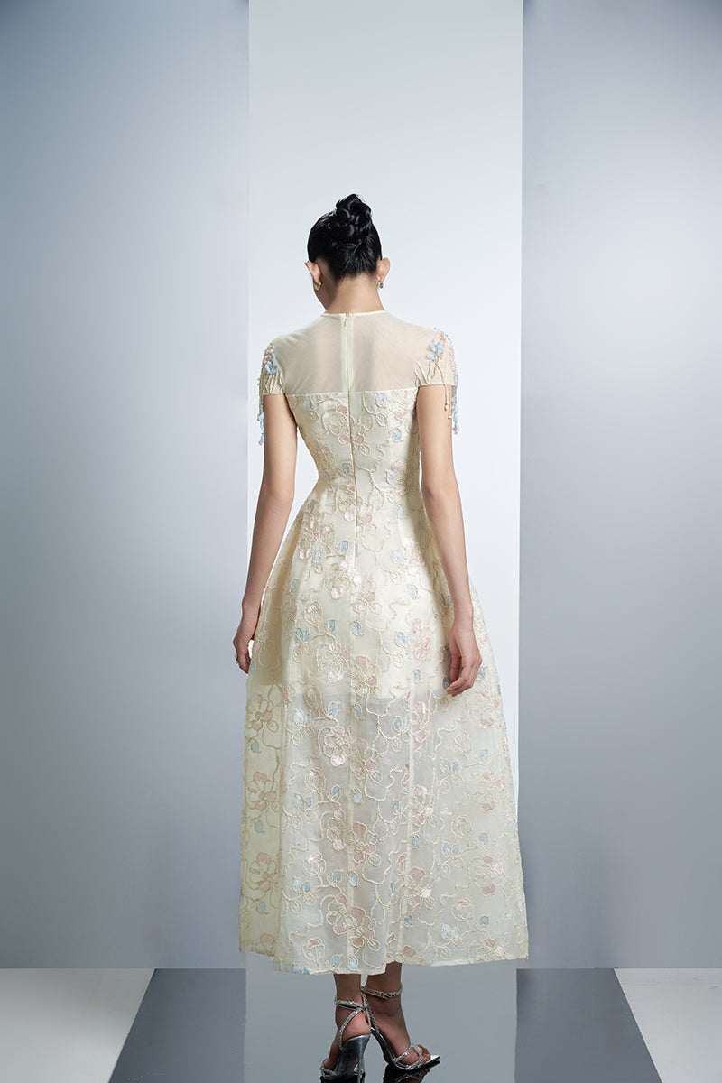Ivory floral organza maxi dress with colorful butterfly embroidery from Happy Clothing, flowing and elegant for special occasions.