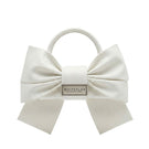 Ivory top handle bag by White Plan with bow detail, showcasing a stylish and elegant accessory for everyday use.