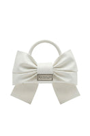 Ivory top handle bag by White Plan with bow detail, showcasing a stylish and elegant accessory for everyday use.