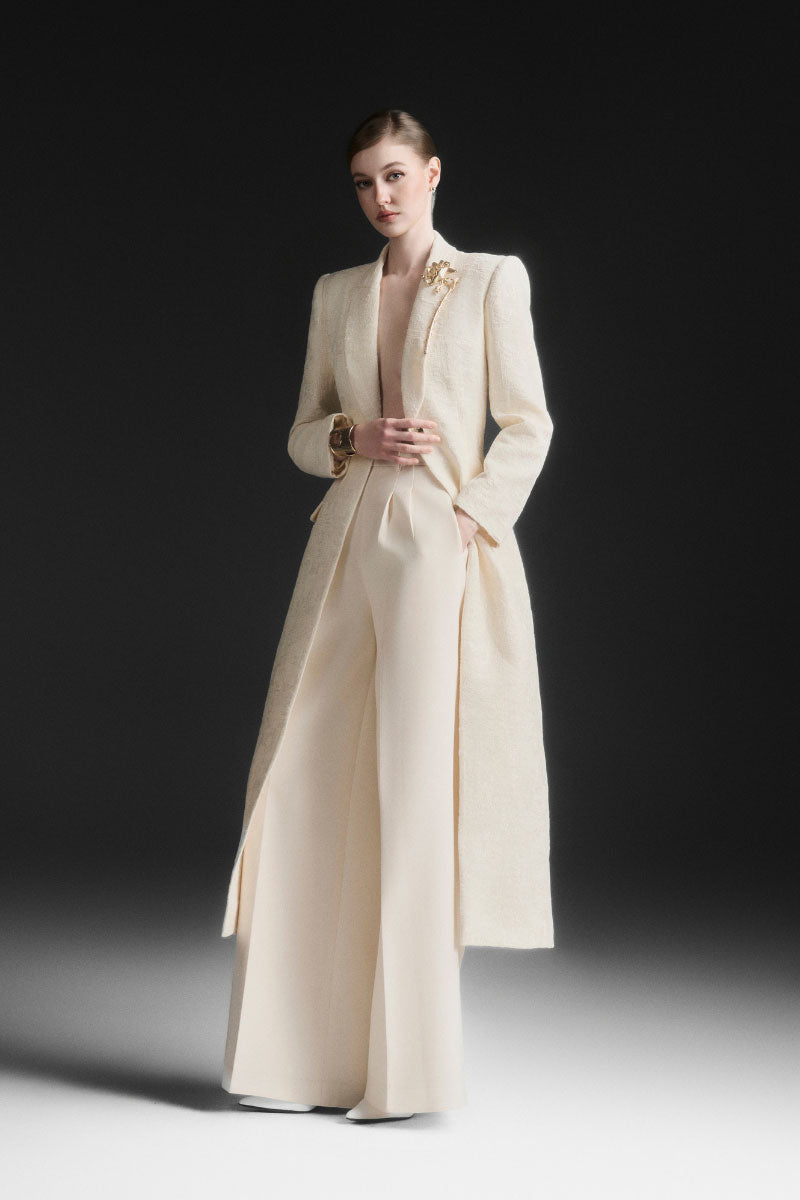 Maison Des Copains ivory cream V-neck trench coat with classic design and tailored fit, displayed on a hanger.