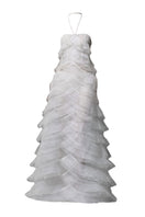 White tulle A-line gown with layered pleats and embellishments by Phan Huy, showcasing elegant, flowing fabric and intricate detailing.