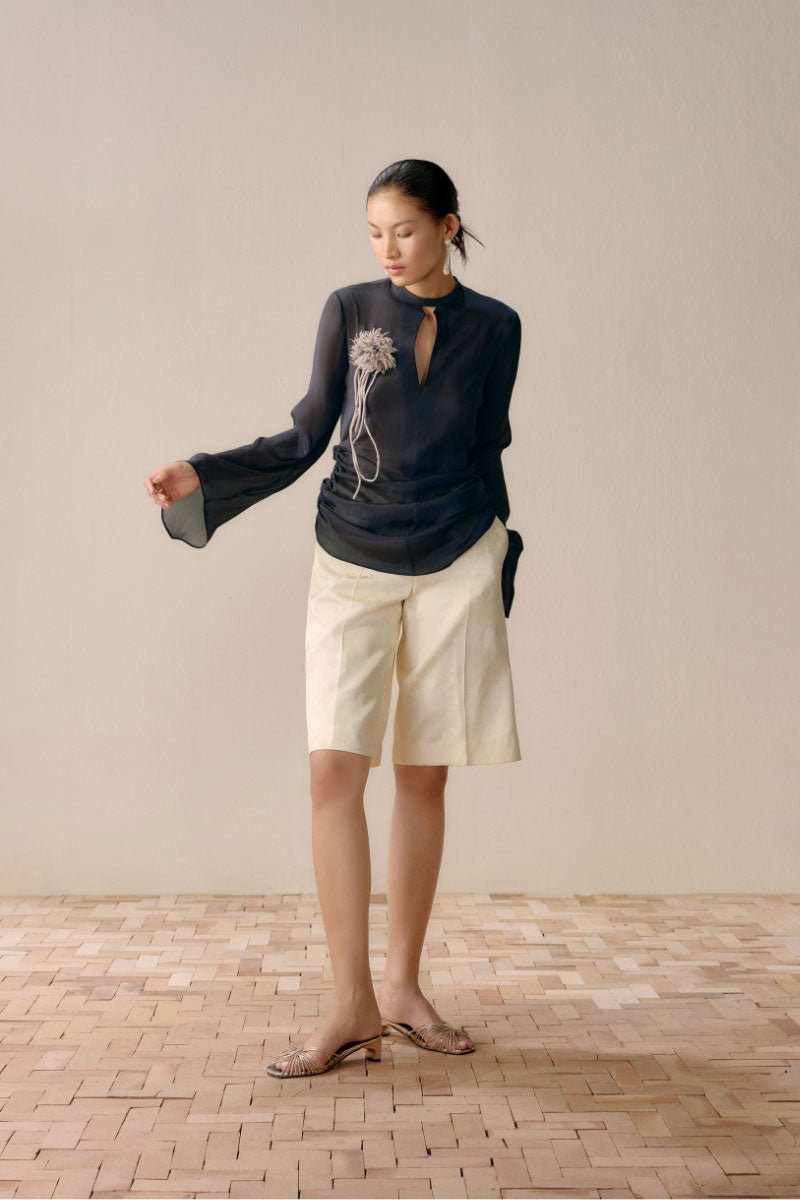 Black Lecca slit front mesh shirt featuring a fashionable design with a front slit and breathable mesh fabric.