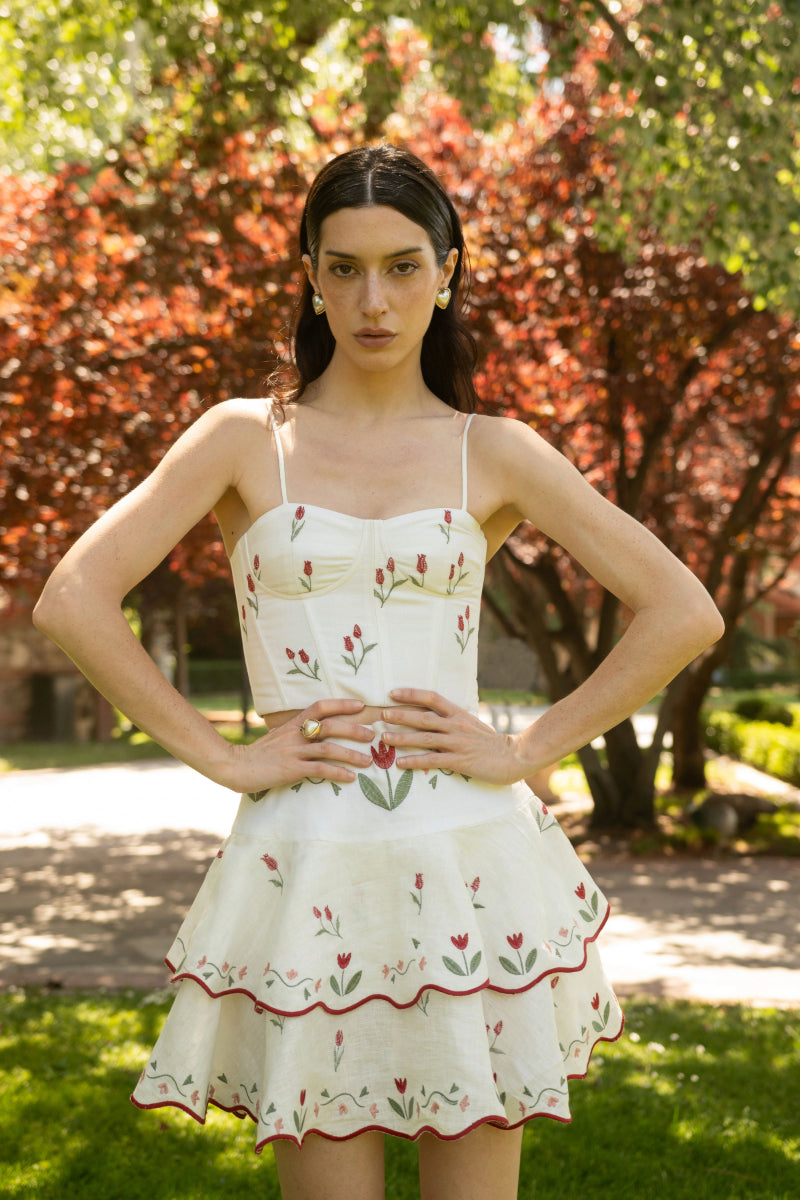 Estefania ivory tulip corset top with structured design and floral detailing, shown on a neutral background.