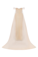 Cream tulle corset gown with matching cape from Sudi Etuz, featuring elegant design and flowing fabric.