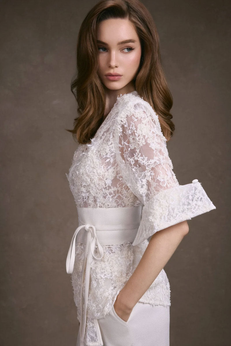 Keira Tong lace wrap top featuring delicate lace fabric and a stylish wrap design, perfect for fashionable tops.