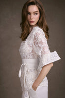 Keira Tong lace wrap top showing intricate lace details and stylish fit, perfect for casual or dressy occasions.