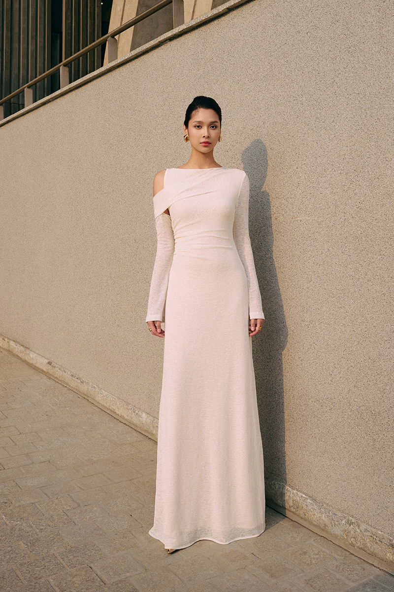 White iridescent maxi dress by EEGEN STUDIO featuring flowing fabric and a stylish, elegant design.