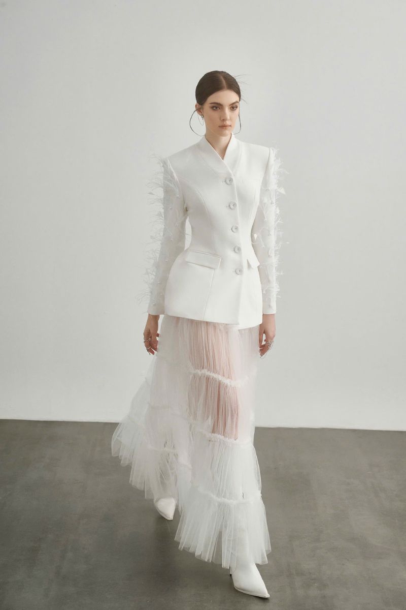 White Jane blazer by Arti Apparel, tailored fit blazer with lapel collar and long sleeves, styled on a mannequin.