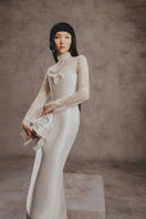 Elegant ivory lace Grace gown by White Plan featuring intricate lace details and a flowing design, perfect for formal occasions.