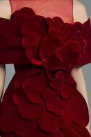 Elegant red velvet gown by Happy Clothing featuring a flowing silhouette and luxurious fabric, perfect for formal occasions.