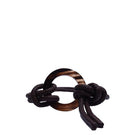Brown leather belt from Adriana Castro's Le Knot Belts collection, featuring a sleek design and high-quality craftsmanship.