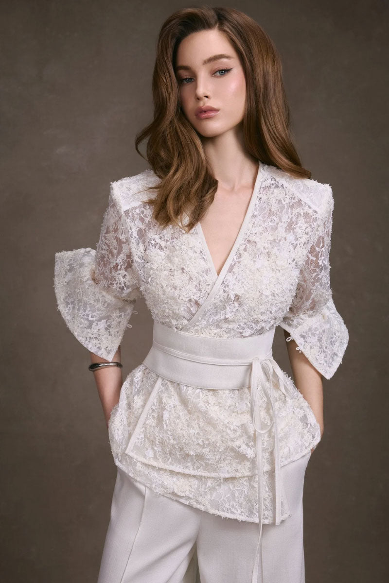 Keira Tong lace wrap top featuring delicate fabric and stylish design, perfect for pairing with casual or dressy outfits.