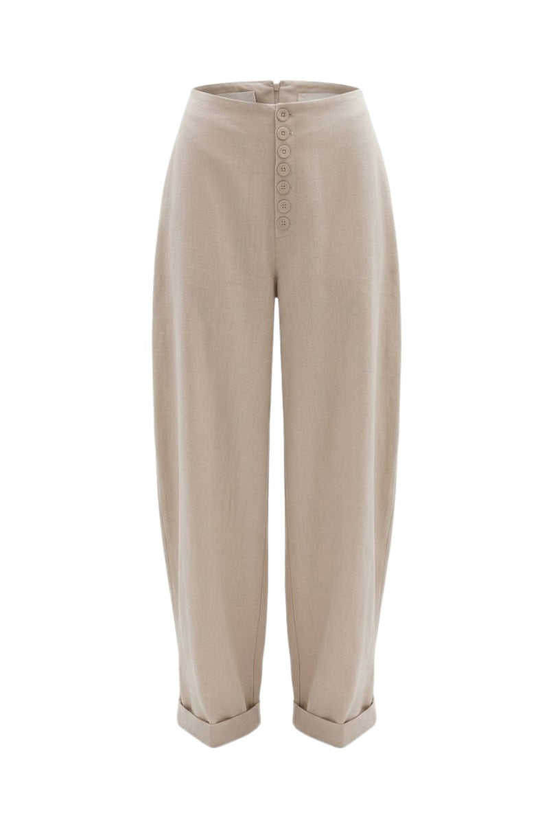 Beige button baggy pants by Keira Tong featuring relaxed fit and casual style, shown on a model.