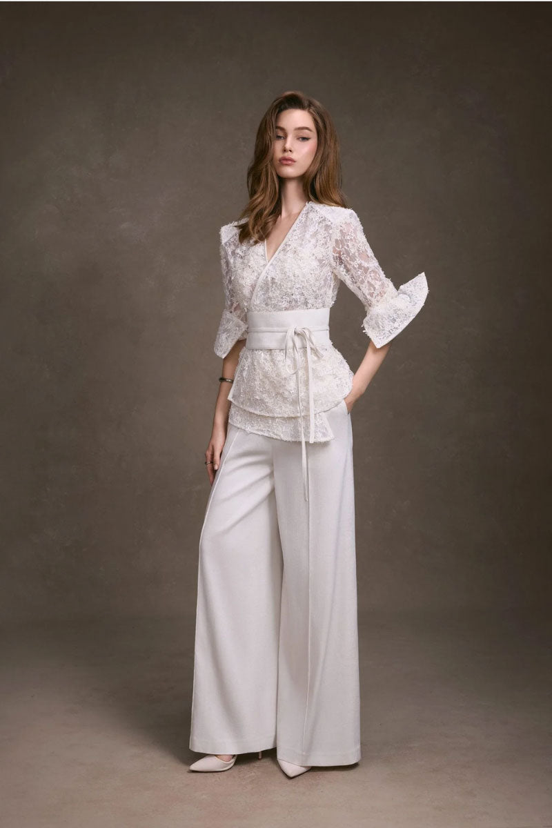 Keira Tong lace wrap top featuring delicate lace fabric and fitted design, perfect for stylish casual or dressy occasions.