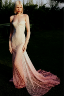 White to pink gradient lace gown with train by Sudi Etuz, featuring delicate lace details and flowing fabric.