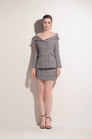 Valenciani multicolor tweed mini skirt featuring a fitted waist and stylish hem, perfect for chic daytime wear.