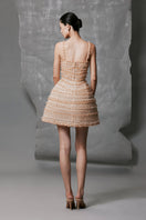 Nude mini shimmering dress by Phan Huy featuring a fitted silhouette and sparkling fabric for elegant evening wear.