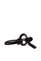 Brown leather belt from Adriana Castro's Le Knot Belt collection, featuring a sleek, stylish design with a knot detail.