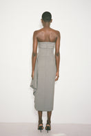 Nué Dylan dress, a stylish midi dress with a flowing design, shown in a natural fabric and elegant silhouette.