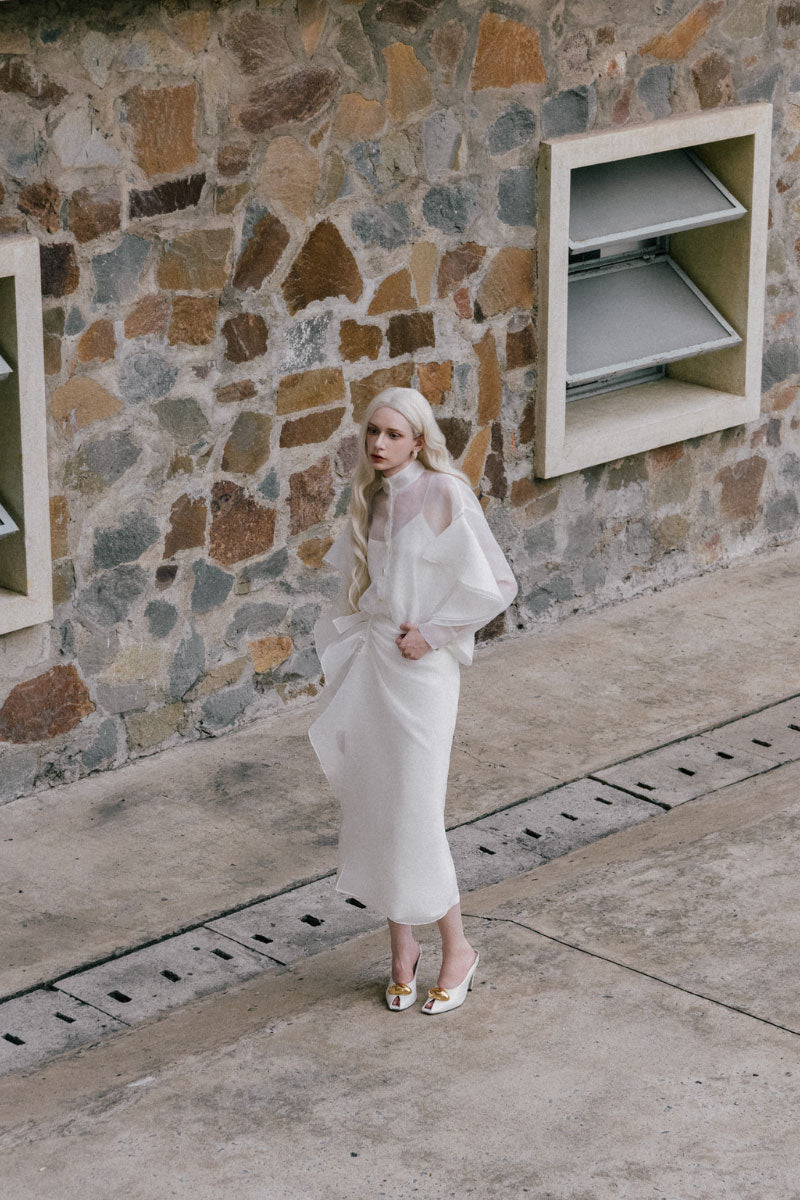 White Plan Lindsay shirt and bone-colored co-ord skirt set, featuring a stylish matching top and skirt ensemble.