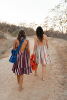 Bani mini navy blue top handle bag with a structured design and sleek top handle, perfect for stylish everyday use.