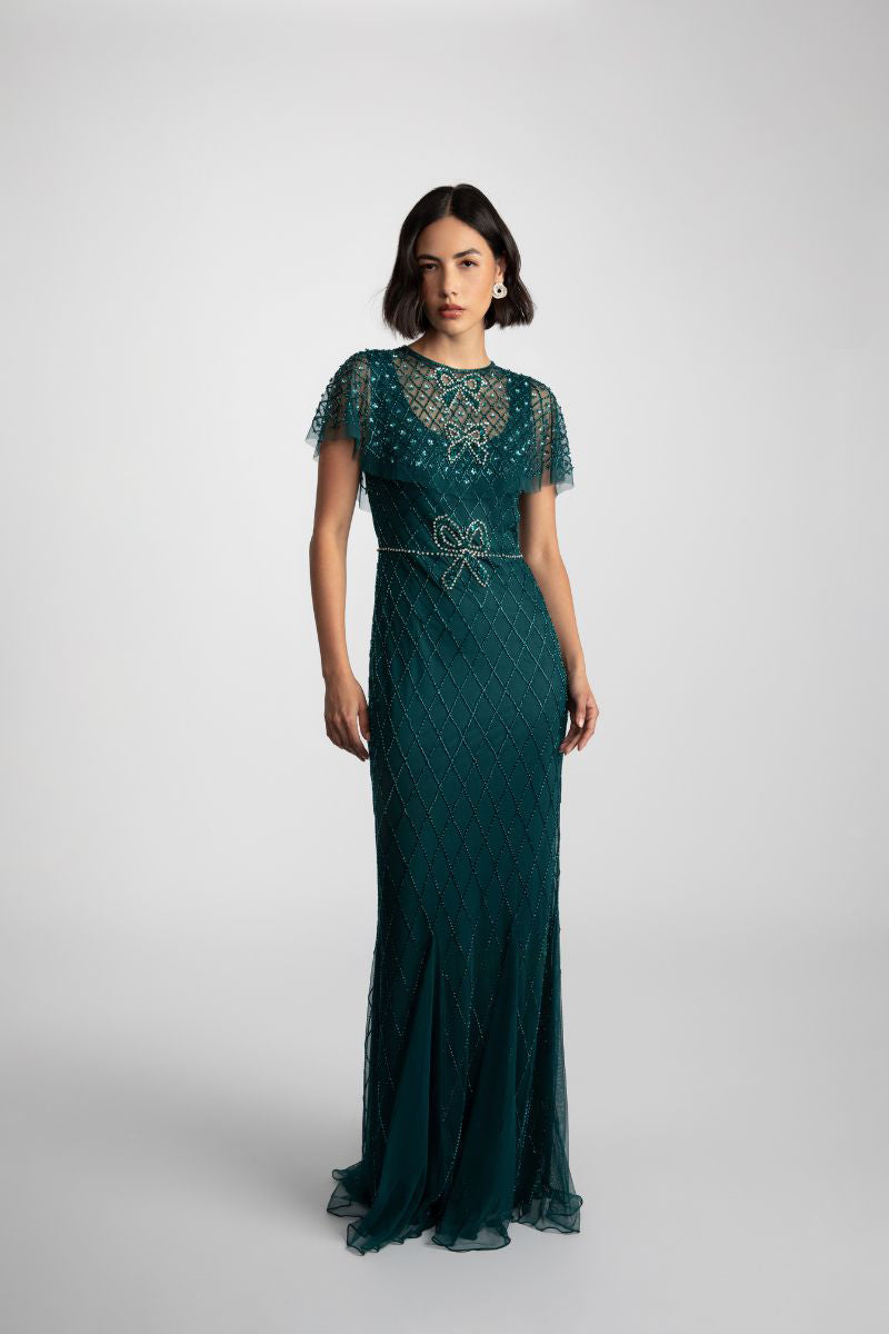 Elegant NINA GOWN by Raishma, featuring intricate lace details and flowing fabric for formal occasions.